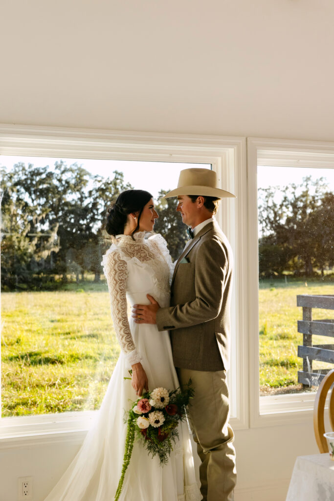 Bride laughing during a western-inspired fall wedding at The Colonial At Sunset in Central Florida.
