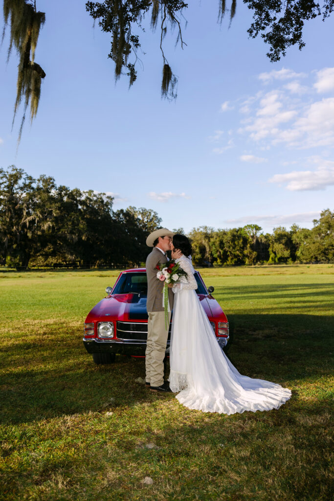 Romantic wedding portraits outside The Colonial At Sunset surrounded by Florida oak trees.