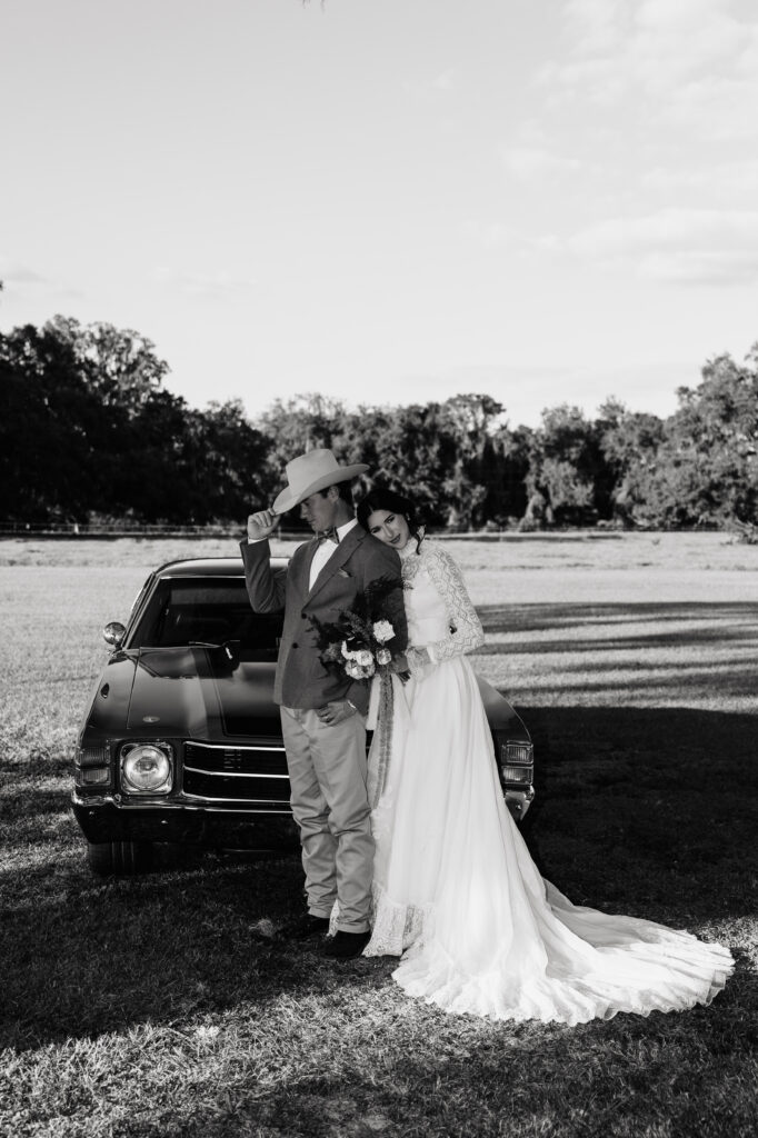 Bride and groom walking through the grounds of The Colonial At Sunset after their wedding ceremony.