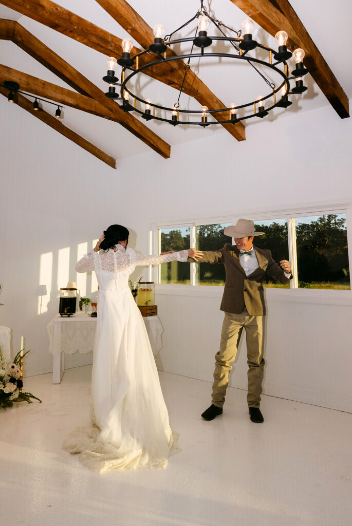 Western wedding couple embracing during golden hour at The Colonial At Sunset in Central Florida.